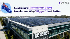 Featured graphic titled “Australia’s Commercial Solar Revolution: Why ‘Bigger’ Isn’t Better.” The image shows a large commercial office building with an expansive rooftop solar PV installation covering nearly the entire roof. Multiple string inverters are mounted along the building façade, highlighting the system’s electrical infrastructure. An Australian flag icon appears in the upper-left corner, with the Finulent Solutions logo in the upper-right. The visual introduces a discussion on optimizing commercial solar projects in Australia, emphasizing that smarter system design and engineering often deliver greater value than simply increasing system size.